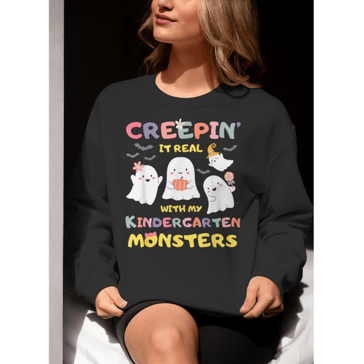 Creepin It Real With Kindergarten Monsters Halloween Teacher Women Crewneck Sweatshirt, funny gift