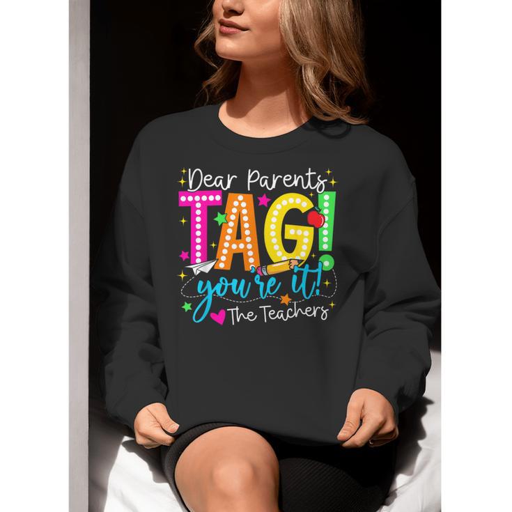Dear Parents Tag You'Re It Love Teachers Last Day Of School Women Crewneck Sweatshirt, funny gift