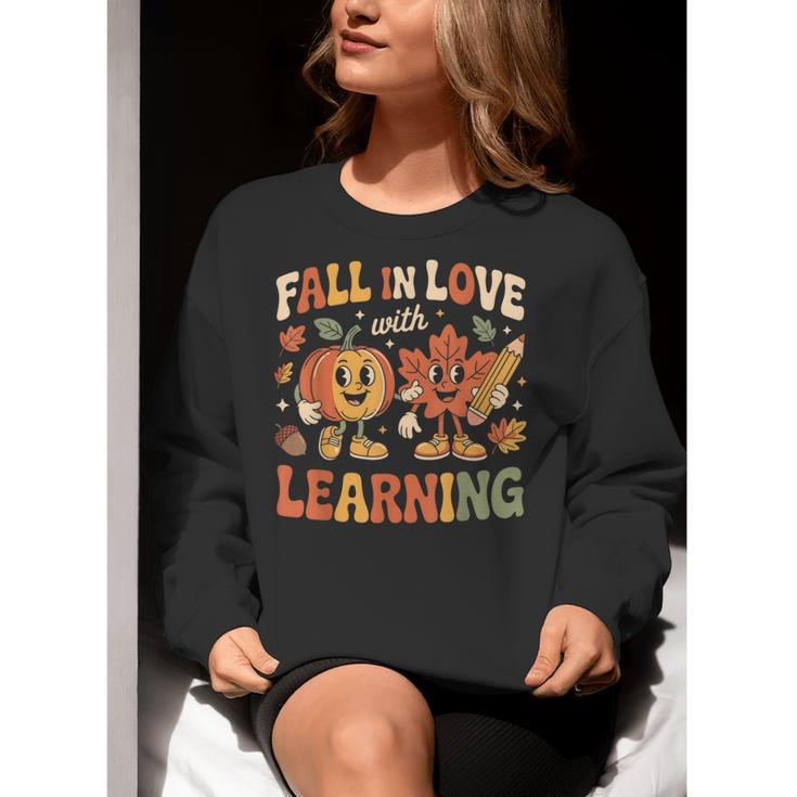 Fall In Love With Learning Retro Autumn Thanksgiving Teacher Women Crewneck Sweatshirt, funny gift Fall In Love With Learning Retro Autumn Thanksgiving Teacher Women Crewneck Sweatshirt, funny gift