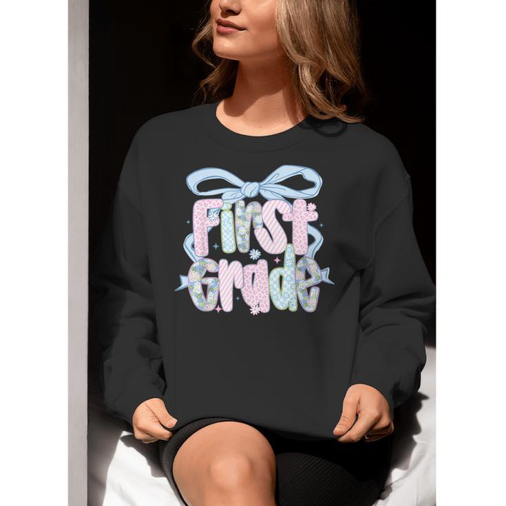 First Grade Coquette Bow Girls Teacher Team 1st Grade Squad Women Crewneck Sweatshirt, First Grade Teacher Sweatshirts, funny gift First Grade Coquette Bow Girls Teacher Team 1st Grade Squad Women Crewneck Sweatshirt, First Grade Teacher Sweatshirts, funny gift