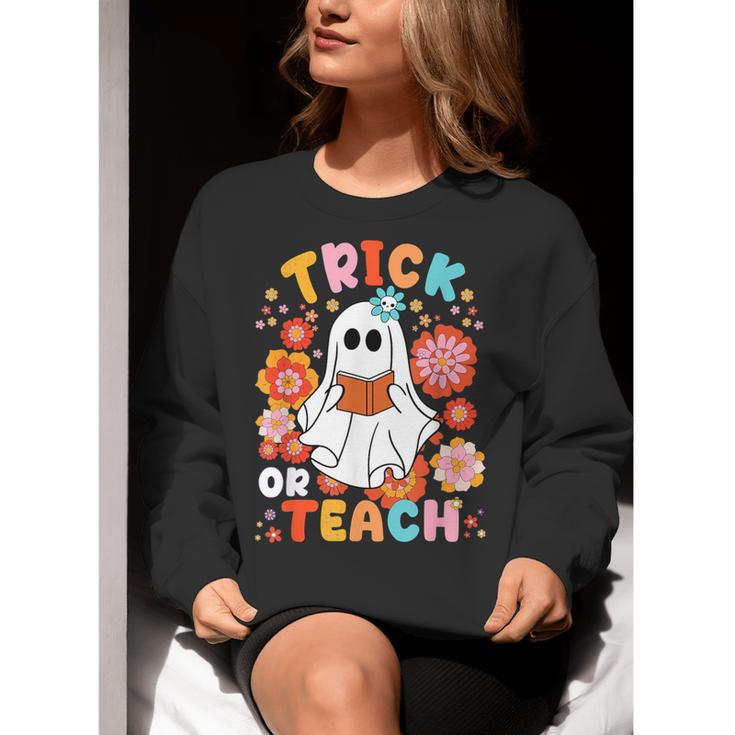 Groovy Halloween Trick Or Teach Retro Floral Ghost Teacher For Men Women Kids Women Crewneck Sweatshirt, Groovy Teacher Sweatshirts, funny gift Groovy Halloween Trick Or Teach Retro Floral Ghost Teacher For Men Women Kids Women Crewneck Sweatshirt, Groovy Teacher Sweatshirts, funny gift