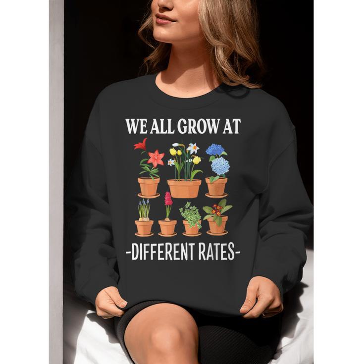 We All Grow At Different Rates Back To School Teacher Women Crewneck Sweatshirt, funny gift