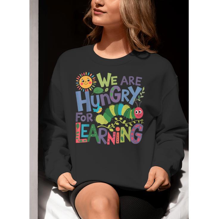 We Are Hungry For Learning Teacher Life Back To School Women Crewneck Sweatshirt, funny gift We Are Hungry For Learning Teacher Life Back To School Women Crewneck Sweatshirt, funny gift