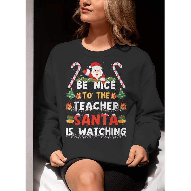 Be Nice To The Teacher Santa Is Watching Christmas Women Crewneck Sweatshirt, funny gift Be Nice To The Teacher Santa Is Watching Christmas Women Crewneck Sweatshirt, funny gift
