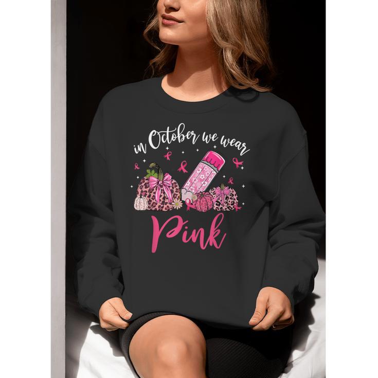 In October We Wear Pink Apple Teacher Daisy Breast Cancer Women Crewneck Sweatshirt, funny gift In October We Wear Pink Apple Teacher Daisy Breast Cancer Women Crewneck Sweatshirt, funny gift