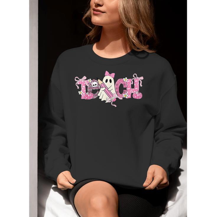Pink Ghost Teach Halloween Teacher In Spooky Season Women Crewneck Sweatshirt, funny gift Pink Ghost Teach Halloween Teacher In Spooky Season Women Crewneck Sweatshirt, funny gift