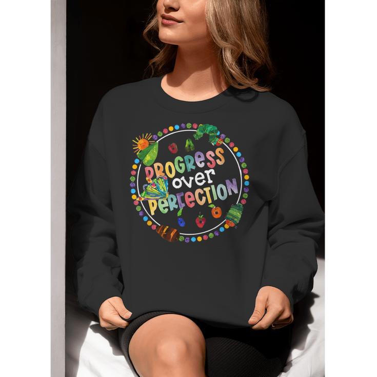 Progress Over Perfection Caterpillar Back To School Teacher Women Crewneck Sweatshirt, funny gift