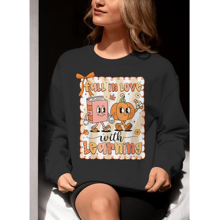 Pumpkin Teacher Preppy Fall In Love With Learning Autumn Women Crewneck Sweatshirt, funny gift