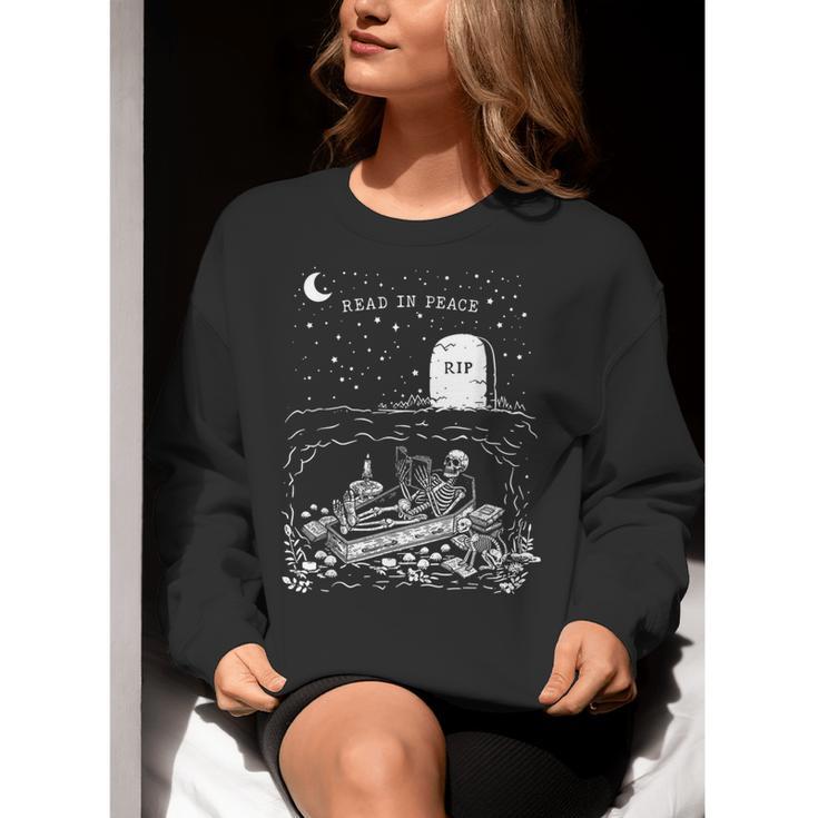 Read In Peace Skeleton Halloween Book Reading Spooky Teacher Women Crewneck Sweatshirt, funny gift Read In Peace Skeleton Halloween Book Reading Spooky Teacher Women Crewneck Sweatshirt, funny gift