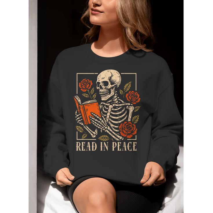Read In Peace Skeleton Reading Book Halloween Teacher Women Crewneck Sweatshirt, funny gift Read In Peace Skeleton Reading Book Halloween Teacher Women Crewneck Sweatshirt, funny gift