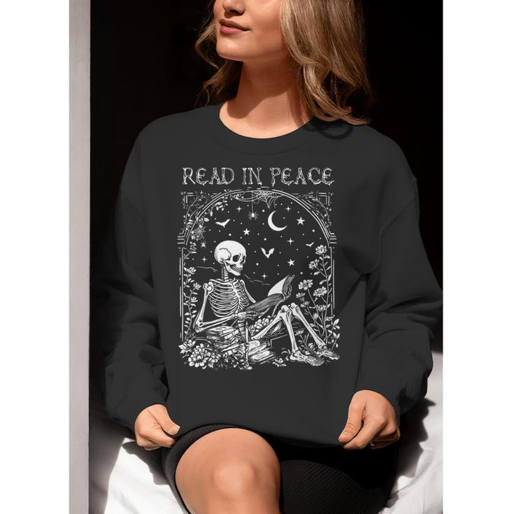 Read In Peace Skeleton Reading Teacher Spooky Halloween Women Crewneck Sweatshirt, funny gift Read In Peace Skeleton Reading Teacher Spooky Halloween Women Crewneck Sweatshirt, funny gift