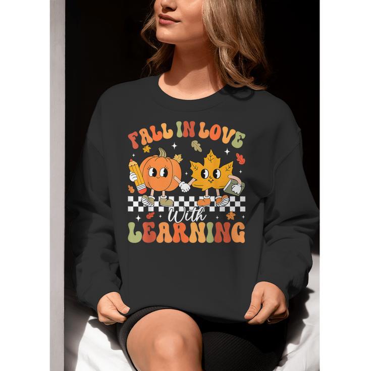 Retro Pumpkin Fall In Love With Learning Autumn Teacher Women Crewneck Sweatshirt, funny gift Retro Pumpkin Fall In Love With Learning Autumn Teacher Women Crewneck Sweatshirt, funny gift