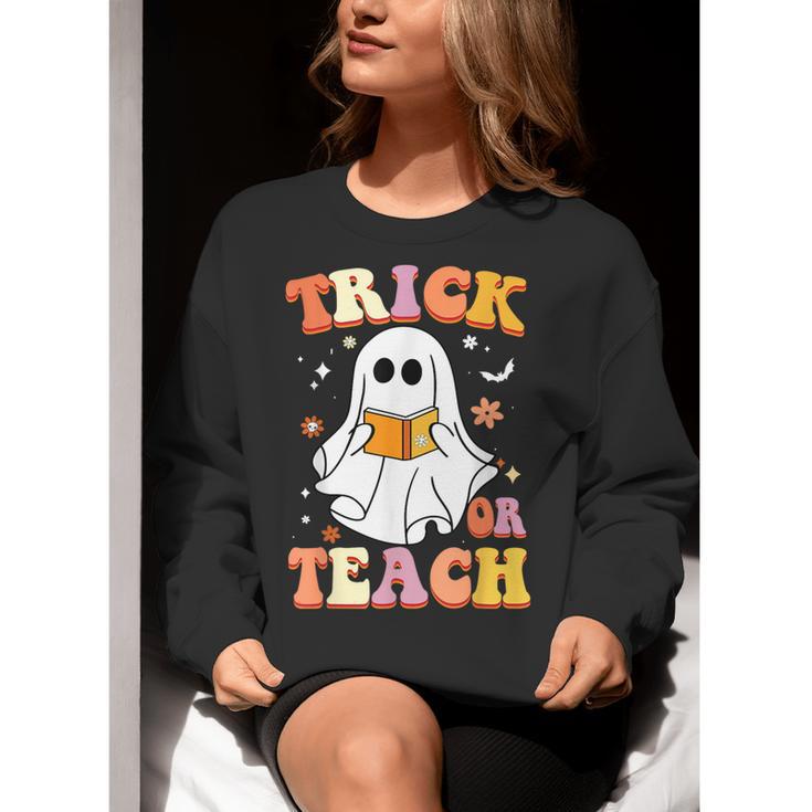 Retro Vintage Groovy Trick Or Teach Teacher Halloween For Men Women Kids Women Crewneck Sweatshirt, Groovy Teacher Sweatshirts, funny gift