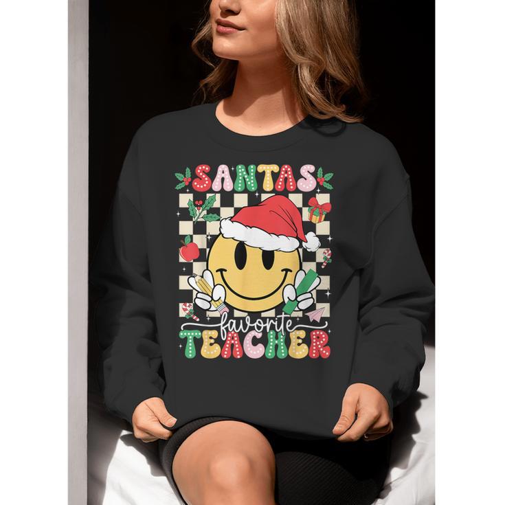 Santas Favorite Teacher Retro Groovy Smile Face Christmas Women Crewneck Sweatshirt, Groovy Teacher Sweatshirts, funny gift
