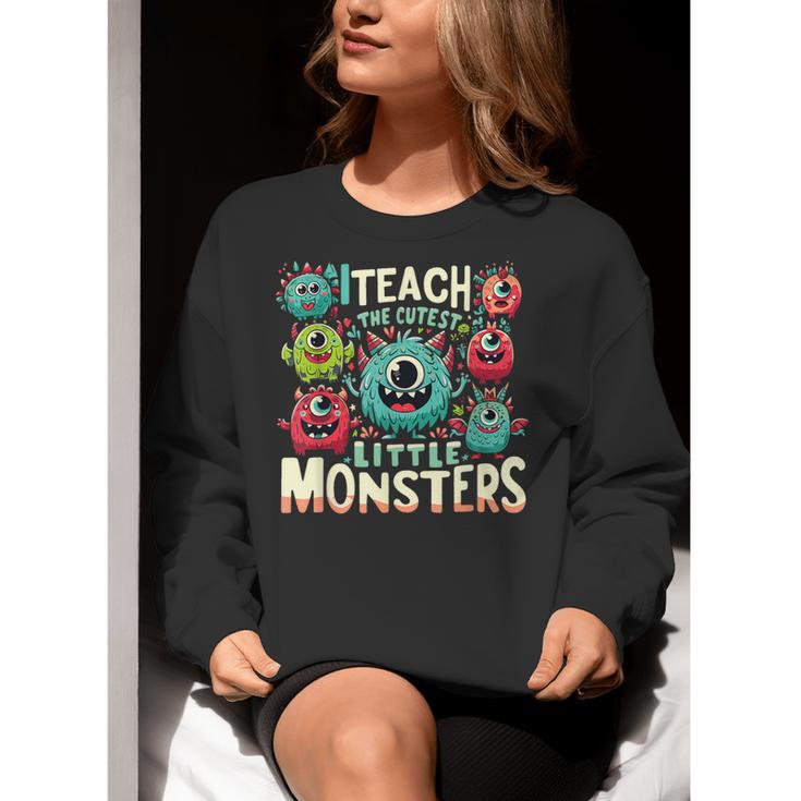 I Teach The Cutest Little Monsters Teacher Halloween Outfit Women Crewneck Sweatshirt, funny gift I Teach The Cutest Little Monsters Teacher Halloween Outfit Women Crewneck Sweatshirt, funny gift