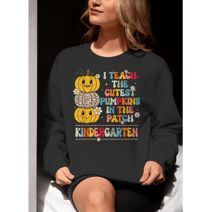 I Teach The Cutest Pumpkins Kindergarten Teacher Halloween Women Crewneck Sweatshirt, funny gift