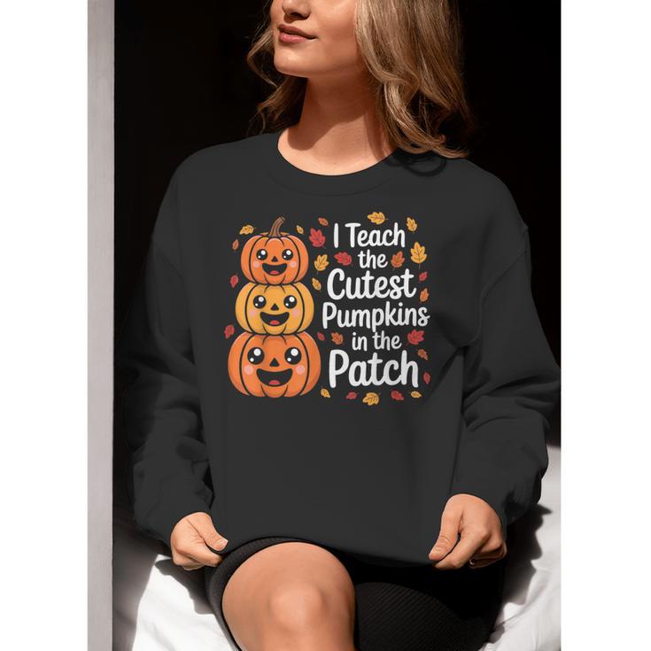 i Teach The Cutest Pumpkins In The Patch Teacher Halloween Women Crewneck Sweatshirt, funny gift