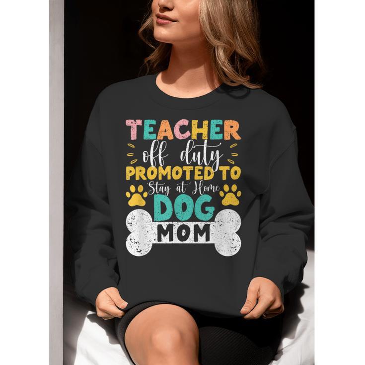 Teacher Off Duty Promoted To Stay At Home Dog Mom Teachers Women Crewneck Sweatshirt, funny gift Teacher Off Duty Promoted To Stay At Home Dog Mom Teachers Women Crewneck Sweatshirt, funny gift