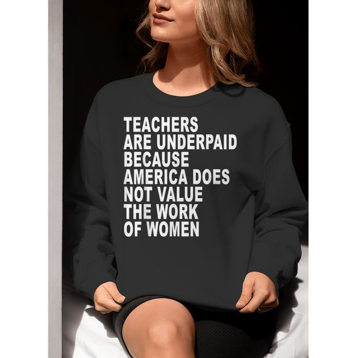 Teachers Are Underpaid Because America Does Not Value Men Women Women Crewneck Sweatshirt, funny gift Teachers Are Underpaid Because America Does Not Value Men Women Women Crewneck Sweatshirt, funny gift