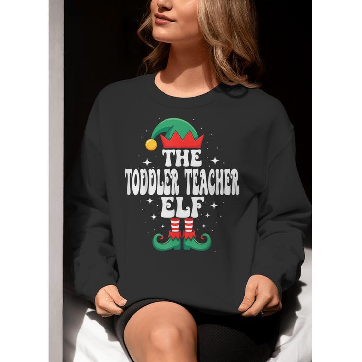 The Toddler Teacher Elf Christmas Matching Family Women Crewneck Sweatshirt, funny gift The Toddler Teacher Elf Christmas Matching Family Women Crewneck Sweatshirt, funny gift