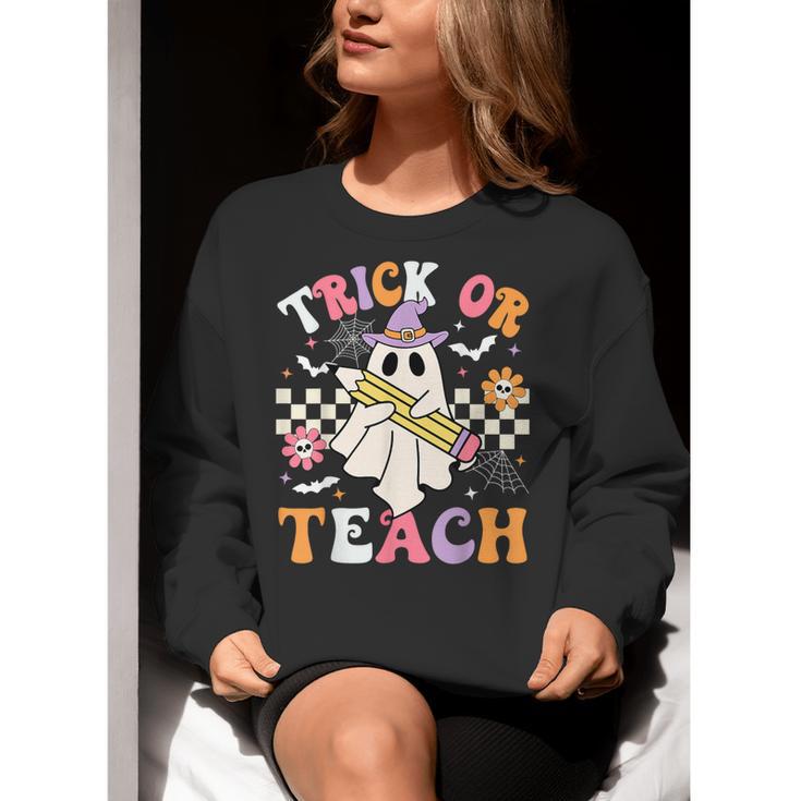 Trick Or Teach Groovy Teacher Halloween Retro Teacher Ghost Women Crewneck Sweatshirt, Groovy Teacher Sweatshirts, funny gift Trick Or Teach Groovy Teacher Halloween Retro Teacher Ghost Women Crewneck Sweatshirt, Groovy Teacher Sweatshirts, funny gift