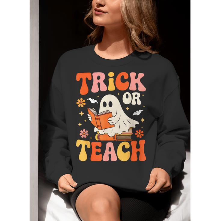 Trick Or Teach Halloween Shirt For Teacher Kids Floral Ghost Women Crewneck Sweatshirt, funny gift Trick Or Teach Halloween Shirt For Teacher Kids Floral Ghost Women Crewneck Sweatshirt, funny gift