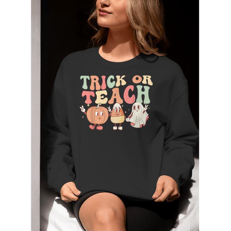Trick Or Teach Pumpkin Candy Corn Ghost Halloween Teacher Women Crewneck Sweatshirt, funny gift Trick Or Teach Pumpkin Candy Corn Ghost Halloween Teacher Women Crewneck Sweatshirt, funny gift