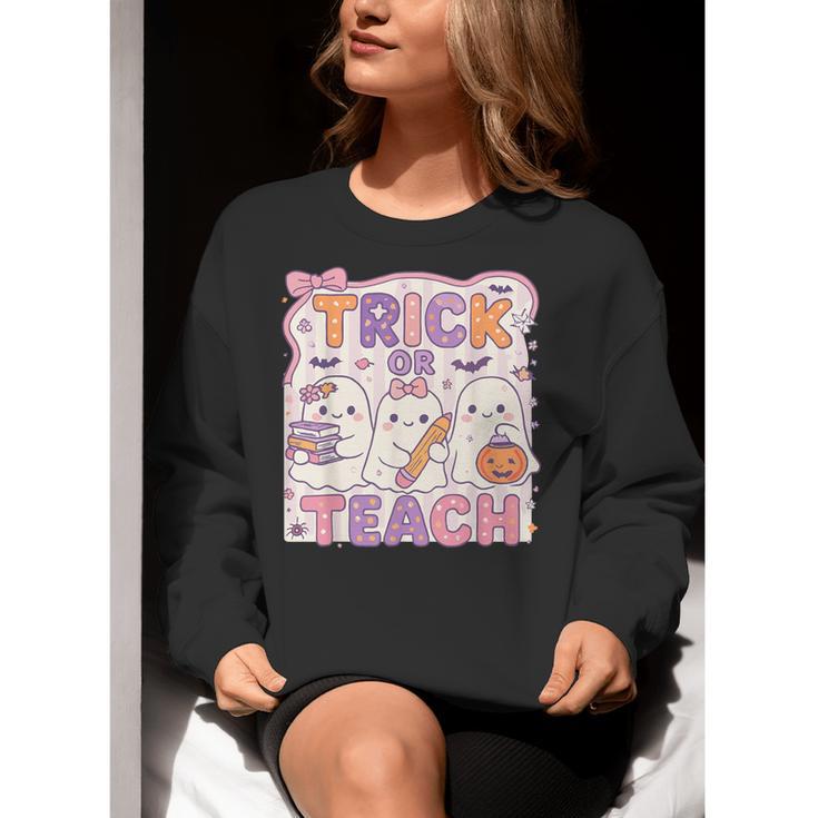 Trick Or Teach Retro Halloween Teacher Look Women Crewneck Sweatshirt, funny gift Trick Or Teach Retro Halloween Teacher Look Women Crewneck Sweatshirt, funny gift
