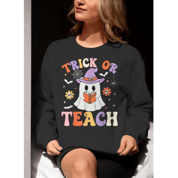 Trick Or Teach Teacher Groovy Ghost Halloween Teacher Women Crewneck Sweatshirt, Groovy Teacher Sweatshirts, funny gift Trick Or Teach Teacher Groovy Ghost Halloween Teacher Women Crewneck Sweatshirt, Groovy Teacher Sweatshirts, funny gift