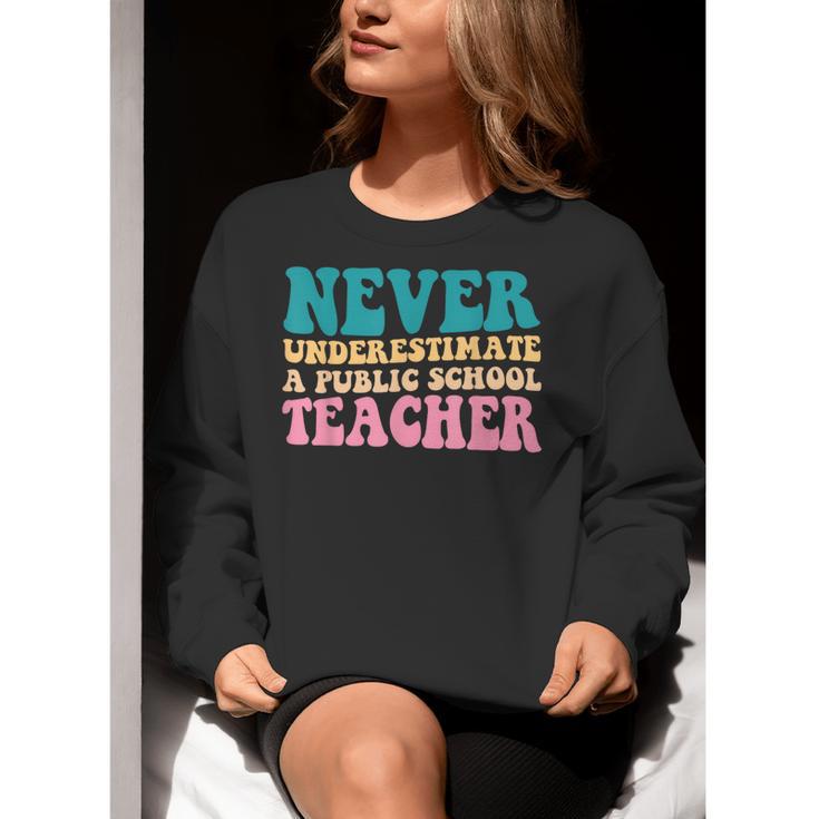 Never Underestimate A Public School Teacher Groovy Women Women Crewneck Sweatshirt, Groovy Teacher Sweatshirts, funny gift Never Underestimate A Public School Teacher Groovy Women Women Crewneck Sweatshirt, Groovy Teacher Sweatshirts, funny gift