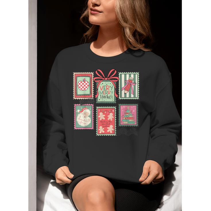 Vintage Preppy Very Merry Teacher Santa Stamps Christmas Women Crewneck Sweatshirt, funny gift Vintage Preppy Very Merry Teacher Santa Stamps Christmas Women Crewneck Sweatshirt, funny gift