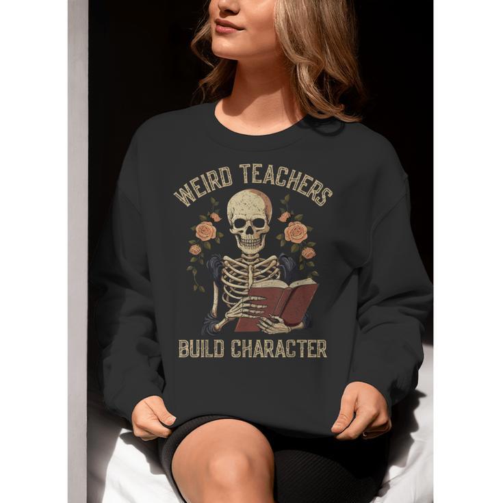 Weird Teachers Build Character Skeleton Book Halloween Women Women Crewneck Sweatshirt, funny gift Weird Teachers Build Character Skeleton Book Halloween Women Women Crewneck Sweatshirt, funny gift