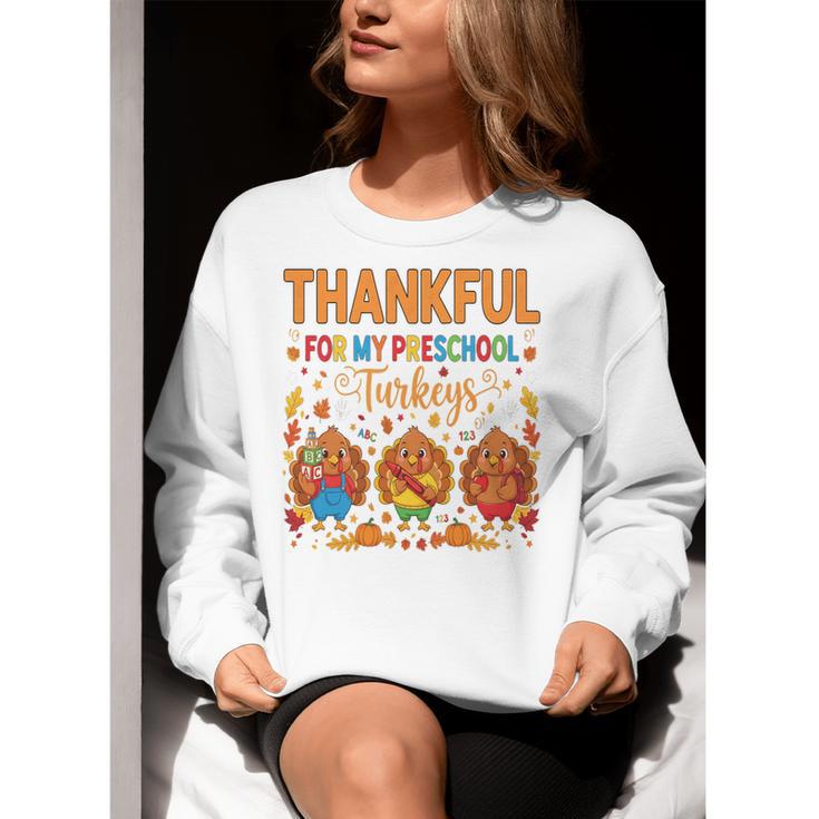 Teach Thanksgiving Teacher Thankful For My Preschool Turkeys Women Crewneck Sweatshirt, funny gift Teach Thanksgiving Teacher Thankful For My Preschool Turkeys Women Crewneck Sweatshirt, funny gift