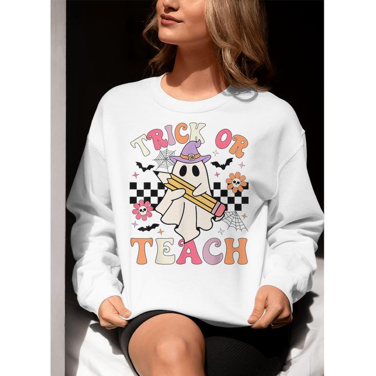 Trick Or Teach Groovy Teacher Halloween Retro Floral Ghost Women Crewneck Sweatshirt, Groovy Teacher Sweatshirts, funny gift