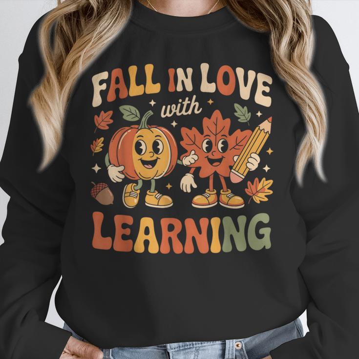 Fall In Love With Learning Retro Autumn Thanksgiving Teacher Women Crewneck Sweatshirt, funny design Fall In Love With Learning Retro Autumn Thanksgiving Teacher Women Crewneck Sweatshirt, funny design