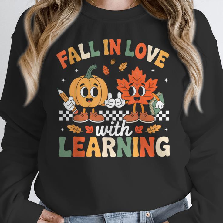 Fall In Love With Learning Shirt Autumn Thanksgiving Teacher Women Crewneck Sweatshirt, funny design
