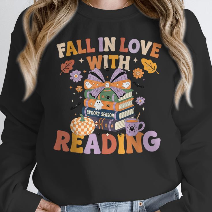 Fall In Love With Reading Halloween Stack Of Book Teacher Women Crewneck Sweatshirt, funny design Fall In Love With Reading Halloween Stack Of Book Teacher Women Crewneck Sweatshirt, funny design