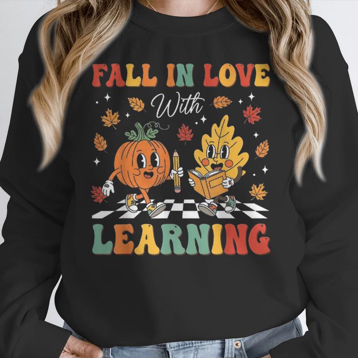 Groovy Fall In Love With Learning Autumn Pumpkin Teacher Women Crewneck Sweatshirt, Groovy Teacher Gifts, funny design
