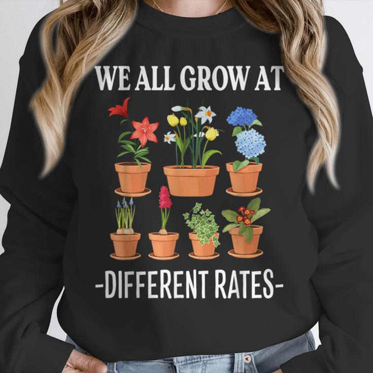 We All Grow At Different Rates Back To School Teacher Women Crewneck Sweatshirt, funny design