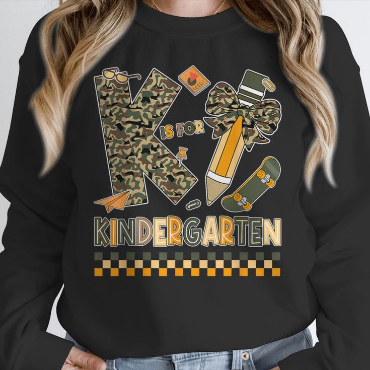 K Is For Kindergarten Teacher Coquette Bow Camo Women Crewneck Sweatshirt, funny design K Is For Kindergarten Teacher Coquette Bow Camo Women Crewneck Sweatshirt, funny design