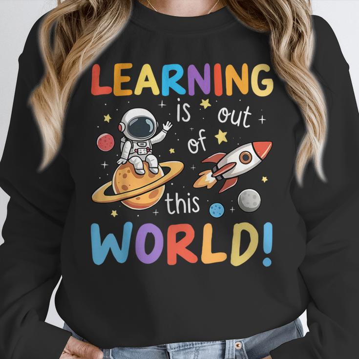 Learning Is Out Of This World Space Back To School Teacher Women Crewneck Sweatshirt, funny design Learning Is Out Of This World Space Back To School Teacher Women Crewneck Sweatshirt, funny design