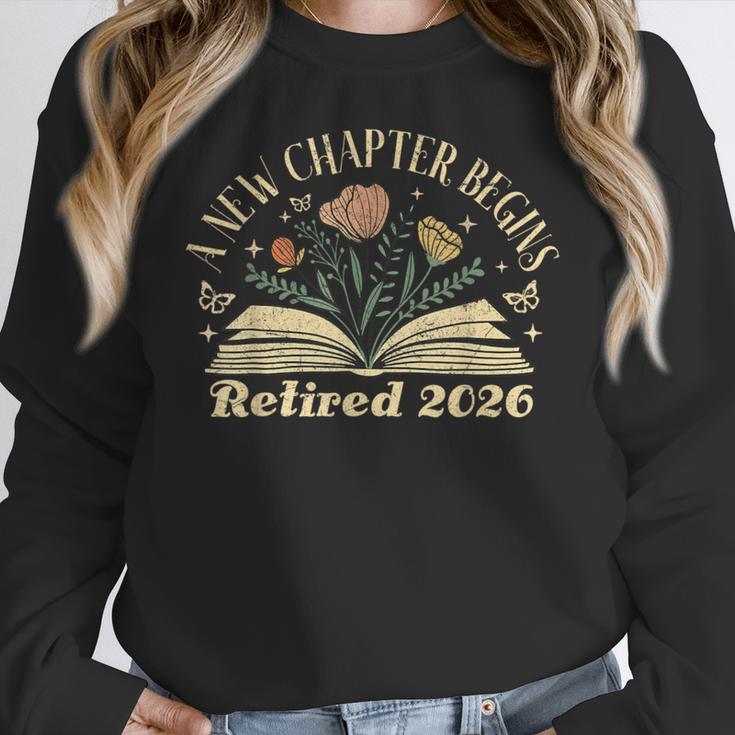 A New Chapter Begins Retired 2026 Teacher Retirement Women Crewneck Sweatshirt, funny design