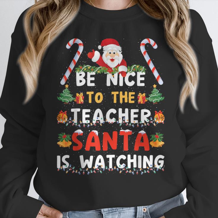 Be Nice To The Teacher Santa Is Watching Christmas Women Crewneck Sweatshirt, funny design Be Nice To The Teacher Santa Is Watching Christmas Women Crewneck Sweatshirt, funny design