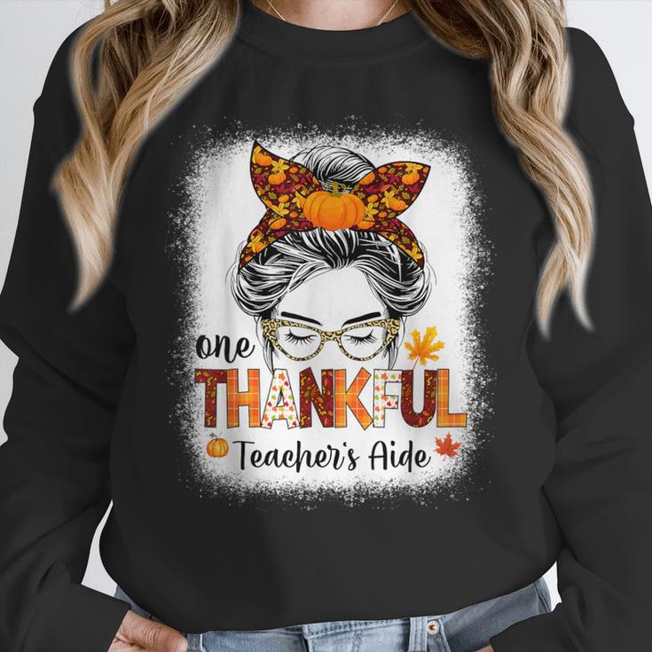 One Thankful Teacher's Aide Messy Bun Thanksgiving Fall Women Crewneck Sweatshirt, funny design One Thankful Teacher's Aide Messy Bun Thanksgiving Fall Women Crewneck Sweatshirt, funny design