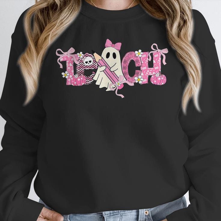 Pink Ghost Teach Halloween Teacher In Spooky Season Women Crewneck Sweatshirt, funny design Pink Ghost Teach Halloween Teacher In Spooky Season Women Crewneck Sweatshirt, funny design