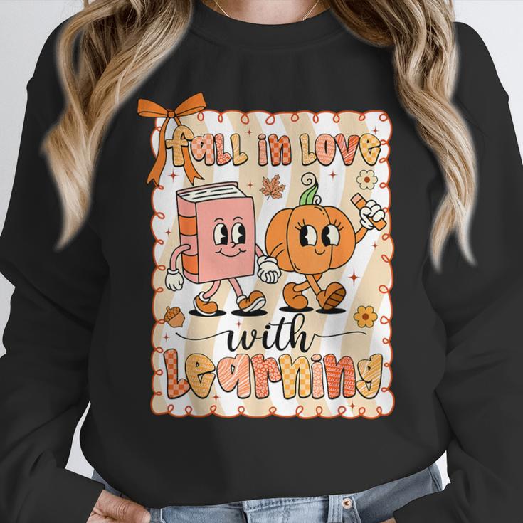 Pumpkin Teacher Preppy Fall In Love With Learning Autumn Women Crewneck Sweatshirt, funny design
