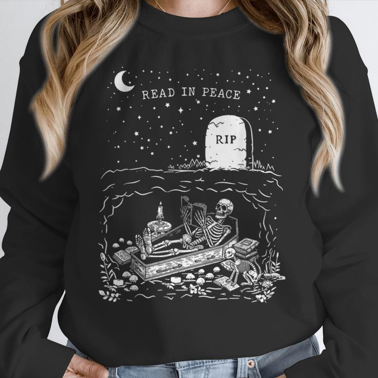 Read In Peace Skeleton Halloween Book Reading Spooky Teacher Women Crewneck Sweatshirt, funny design Read In Peace Skeleton Halloween Book Reading Spooky Teacher Women Crewneck Sweatshirt, funny design