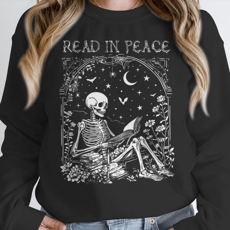 Read In Peace Skeleton Reading Teacher Spooky Halloween Women Crewneck Sweatshirt, funny design Read In Peace Skeleton Reading Teacher Spooky Halloween Women Crewneck Sweatshirt, funny design