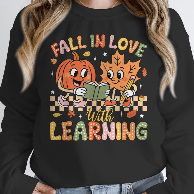 Retro Fall In Love With Learning Autumn Pumpkin Teacher Kids Women Crewneck Sweatshirt, funny design Retro Fall In Love With Learning Autumn Pumpkin Teacher Kids Women Crewneck Sweatshirt, funny design