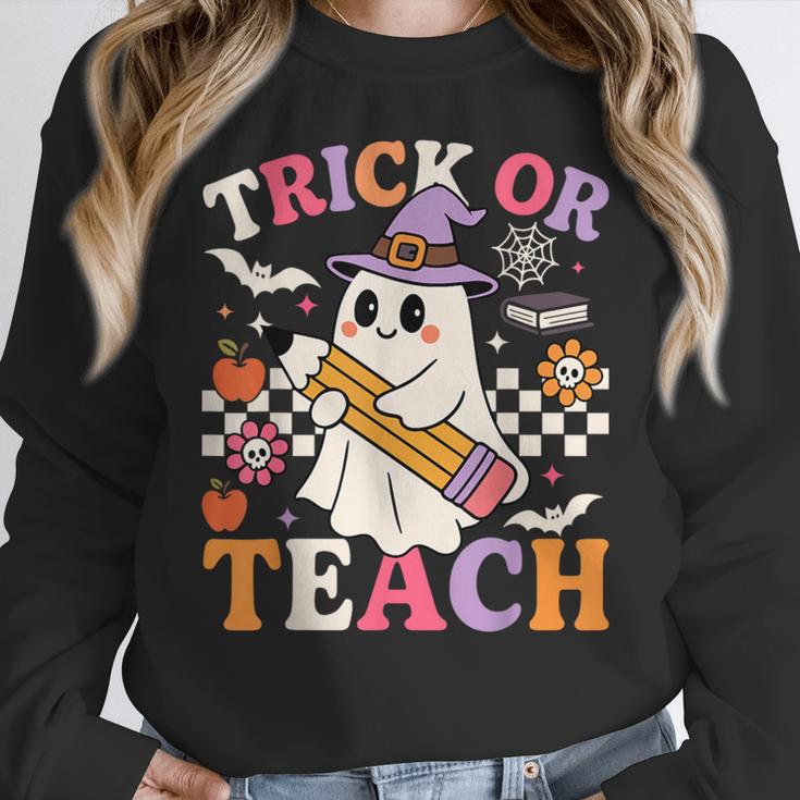 Retro Floral Ghost Trick Or Teach Groovy Teacher Halloween Women Crewneck Sweatshirt, Groovy Teacher Gifts, funny design Retro Floral Ghost Trick Or Teach Groovy Teacher Halloween Women Crewneck Sweatshirt, Groovy Teacher Gifts, funny design